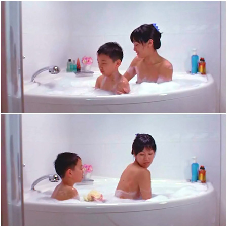 Mother and son wash each other