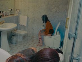 Girl pissing while another girl take a bath