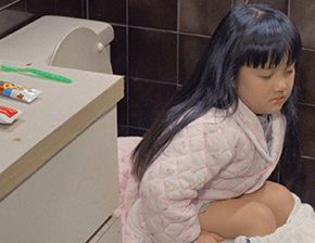 Girl fell asleep peeing on the toilet