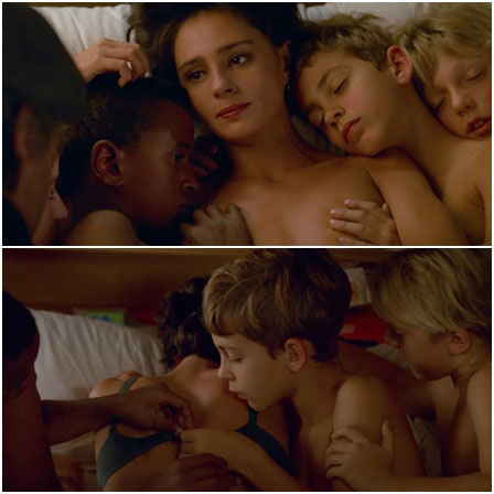 Naked woman in bed with children