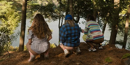 Three girlfriends peeing on the lake shore