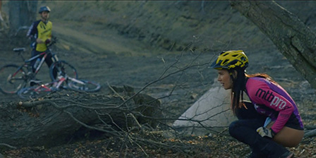 Cyclist urinates in the woods