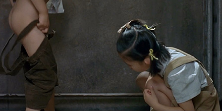 Boy and a girl are pissing opposite each other