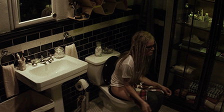 Girl with dreadlocks pees
