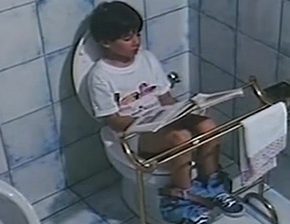 Girl reads and pees