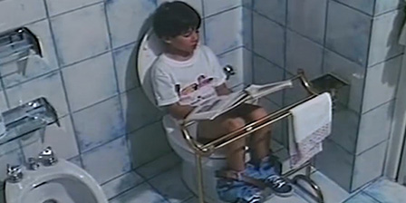 Girl reads and pees