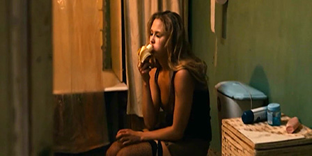 Woman eats banana while urinating