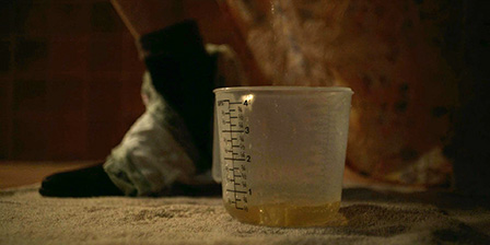 Sally Hawkins pissing in plastic glass