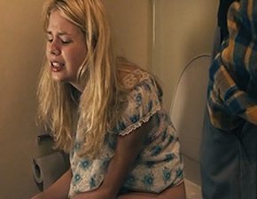 Man helps a girl in the toilet