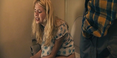 Man helps a girl in the toilet